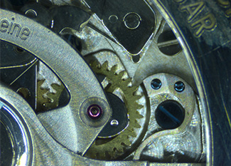 Clock gears under microscope